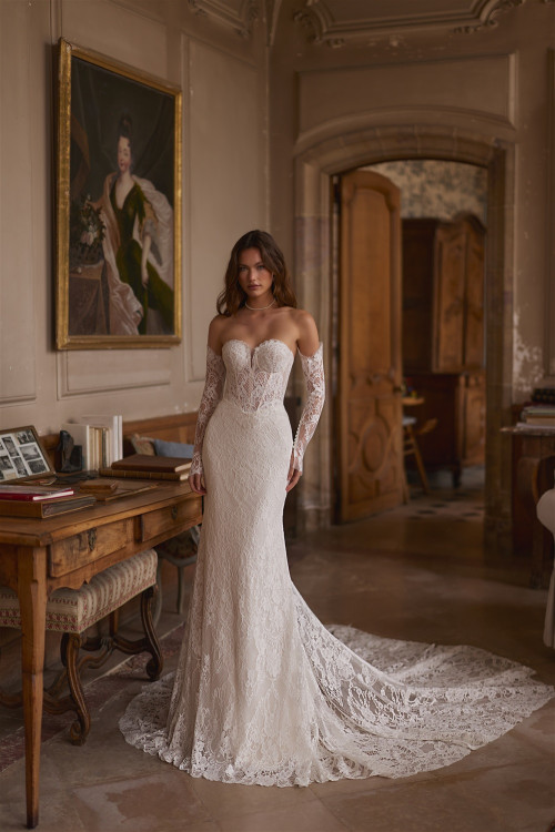 Fitted lace wedding dress with corset, separate sleeves, and train
