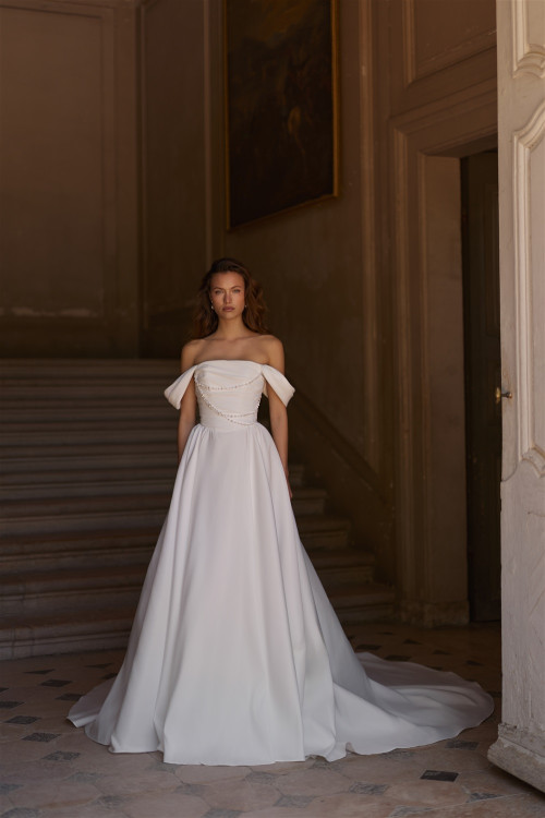 Elegant minimalist wedding dress with straight neckline and drooping straps